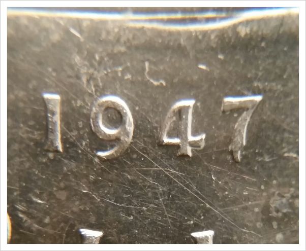 1947-Pointed-7-Canadian-Dollar